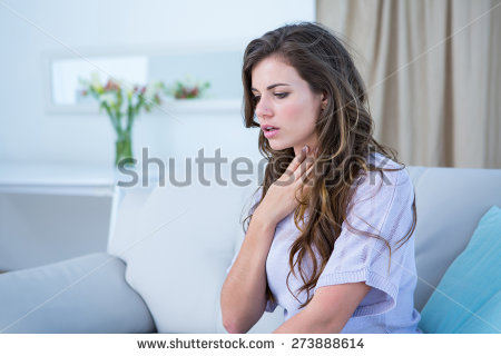 stock-photo-pretty-woman-doing-asthma-crisis-at-home-in-the-living-room-273888614